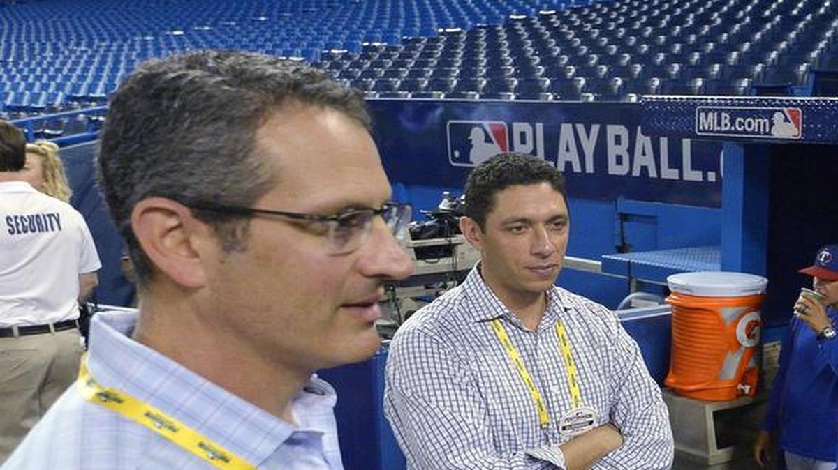 Texas Rangers assistant GM Thad Levine, left, is expected to become the general manager of the Minnesota Twins.