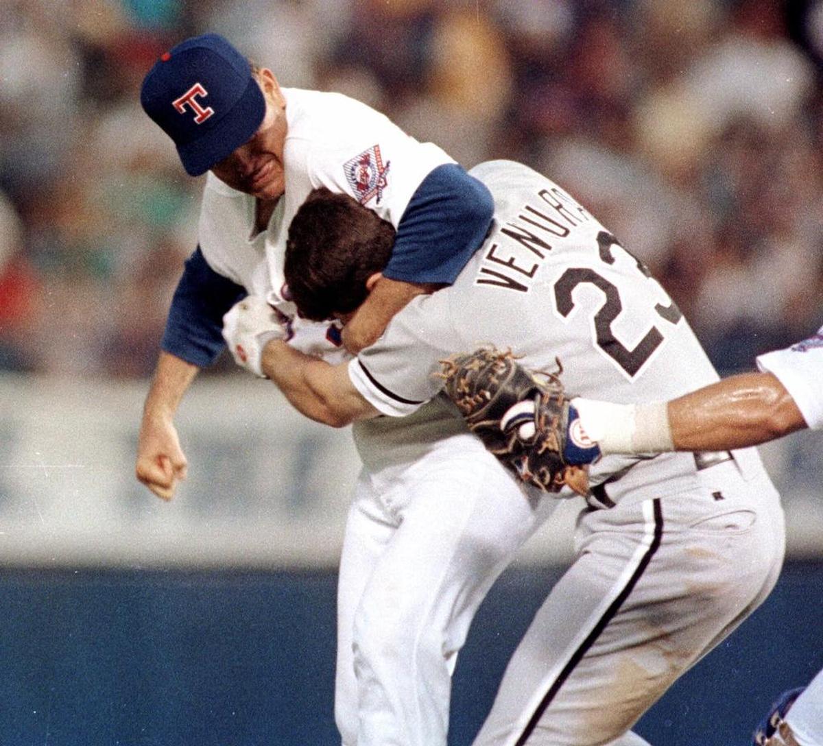 Texas Rangers pitcher Nolan Ryan, left, hits Robin Ventura of the Chicago White Sox after Ventura charged the mound in Arlington, Texas, on August 4, 1993.