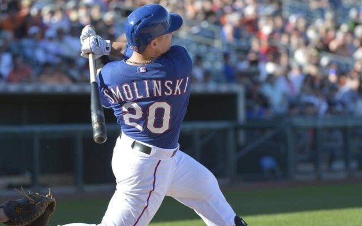 
Rangers left fielder Jake Smolinski, batting earlier this spring, impressed with his glove Sunday while making a nice catch.


