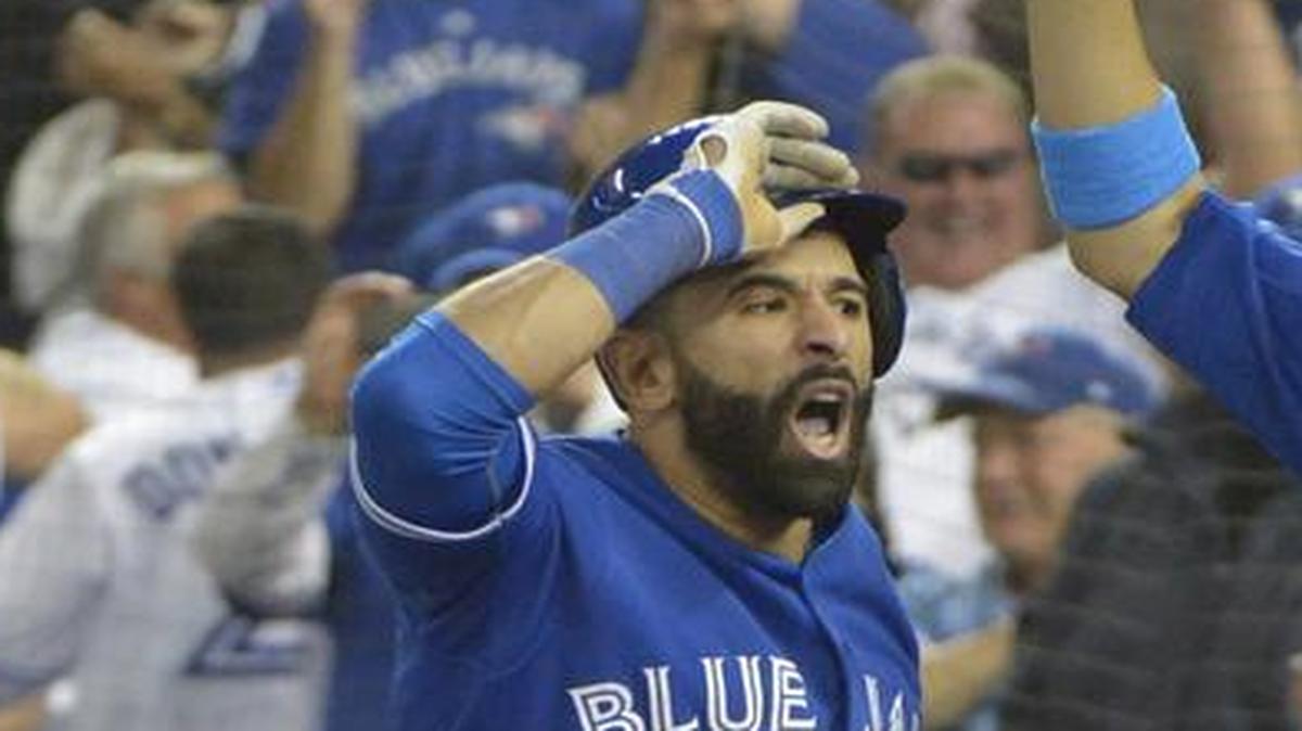 
The Rangers understand that Jose Bautista, left, was emotional after hitting the key homer in Game 5, but they didn’t care for his bat flip.
