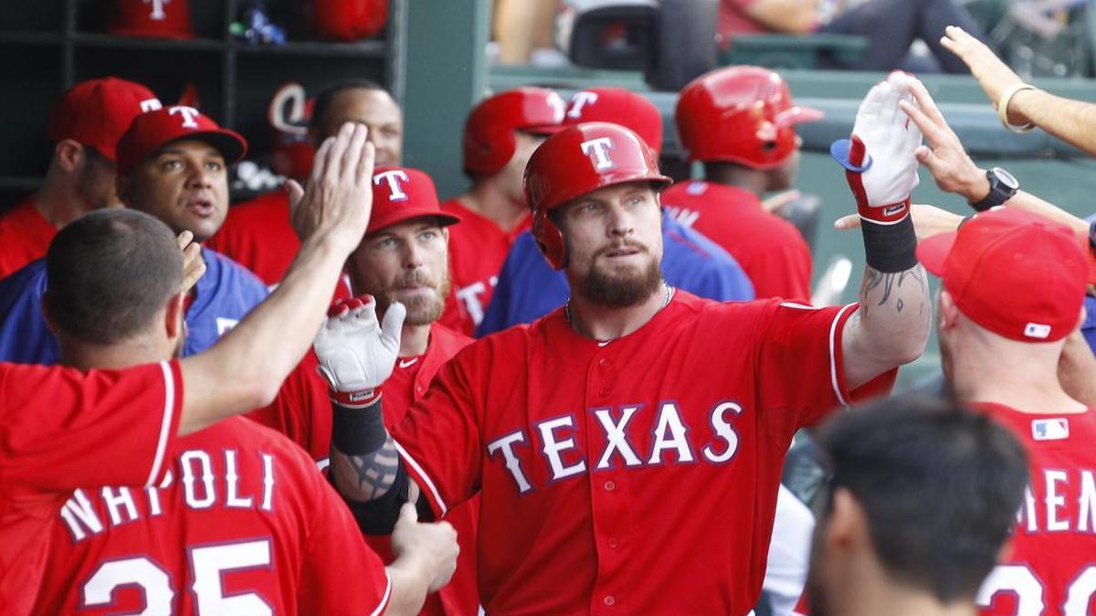 
Rangers Josh Hamilton gets high fives in the dugout after a second inning home run against the Tampa Bay Rays at Globe Life Park on Friday.
