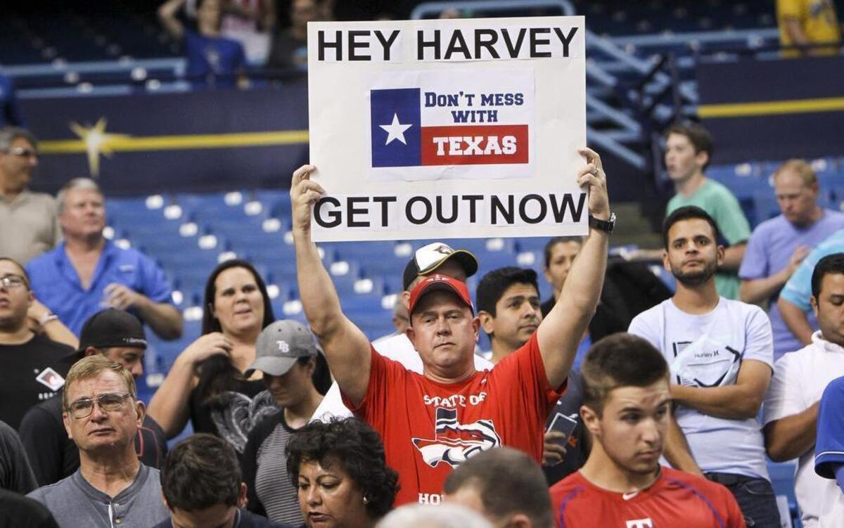 Fans show support for the people of Houston dealing with the effects of Hurricane Harvey during the Rangers-Astros game at Tropicana Field in St. Petersvburg, Fla. The Rangers have won the first two games of the series, including an 8-1 win Wednesday night.