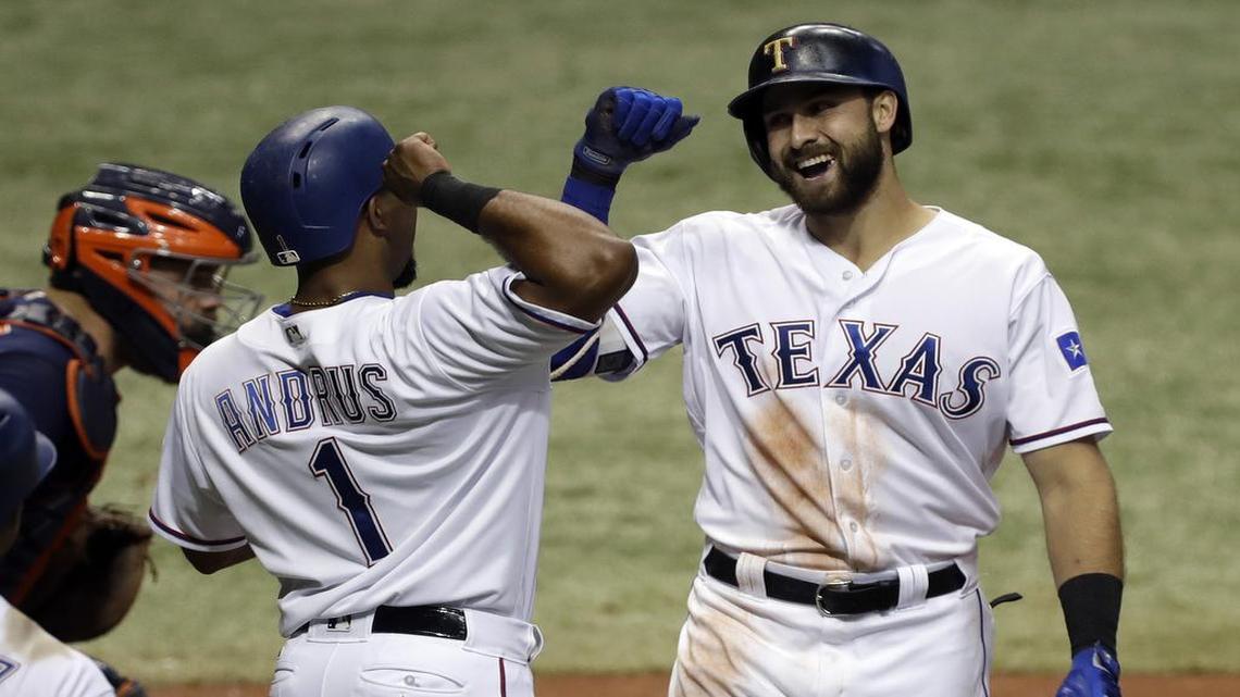 Joey Gallo, right, celebrates his two-run home run Tuesday night against the Astros with Elvis Andrus in third inning at Tropicana Field in St. Petersburg, Fla.
