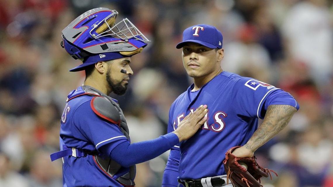 Robinson Chirinos, left, talks with Texas Rangers relief pitcher Keone Kela during an appearance in June. Kela made his first appearance since June 27 Saturday in the eighth inning against the Rays.