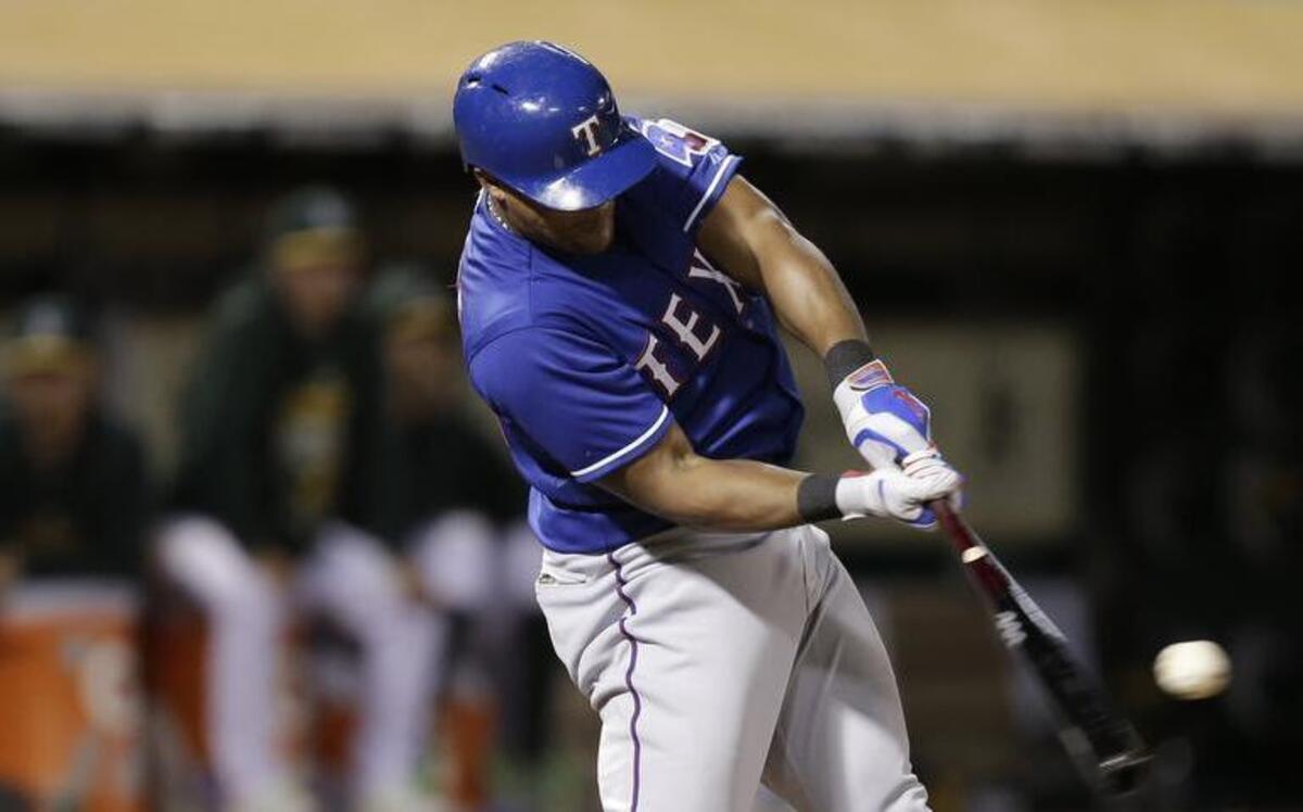 
Adrian Beltre unloads for a three-run homer in the fifth inning that gave the Rangers a 7-1 cushion.
