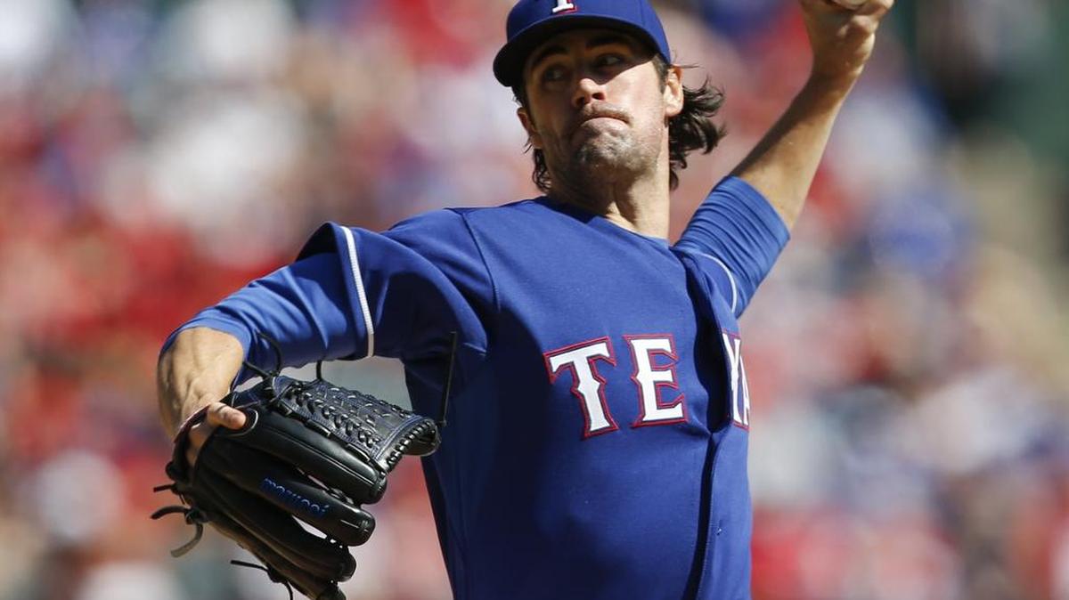 
Rangers starting pitcher Cole Hamels held the Los Angeles Angels hitless after the second inning as Texas won the A.L. West with a 9-2 win Sunday.
