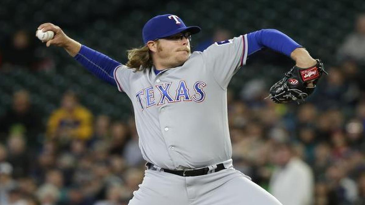 Texas Rangers starting pitcher A.J. Griffin throws against the Seattle Mariners in the first inning Wednesday.