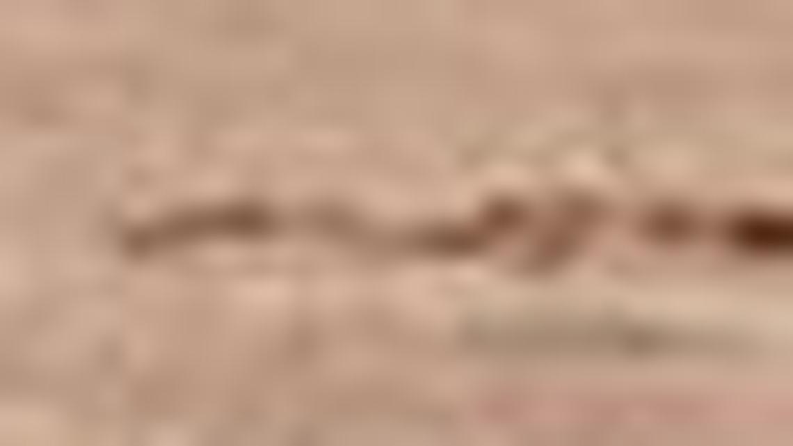 Last Sunday in a game against the Texas Rangers, Oakland Athletics player Mark Canha (20) places his hand on the shoulder of Bruce Maxwell as Maxwell takes a knee during the national anthem prior to the baseball game in Oakland, Calif. Maxwell also has taken a knee during the Rangers games Thursday and Friday, but Thursday he was in the visiting bullpen out of sight of most fans.