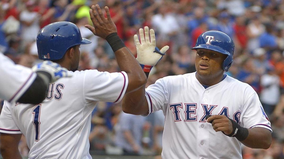 
Rangers shortstop Elvis Andrus, left, congratulates third baseman Adrian Beltre after Beltre’s first innin two-run homer. Texas beat the the San Francisco Giants 6-3 Friday night at Globe Life Park.
