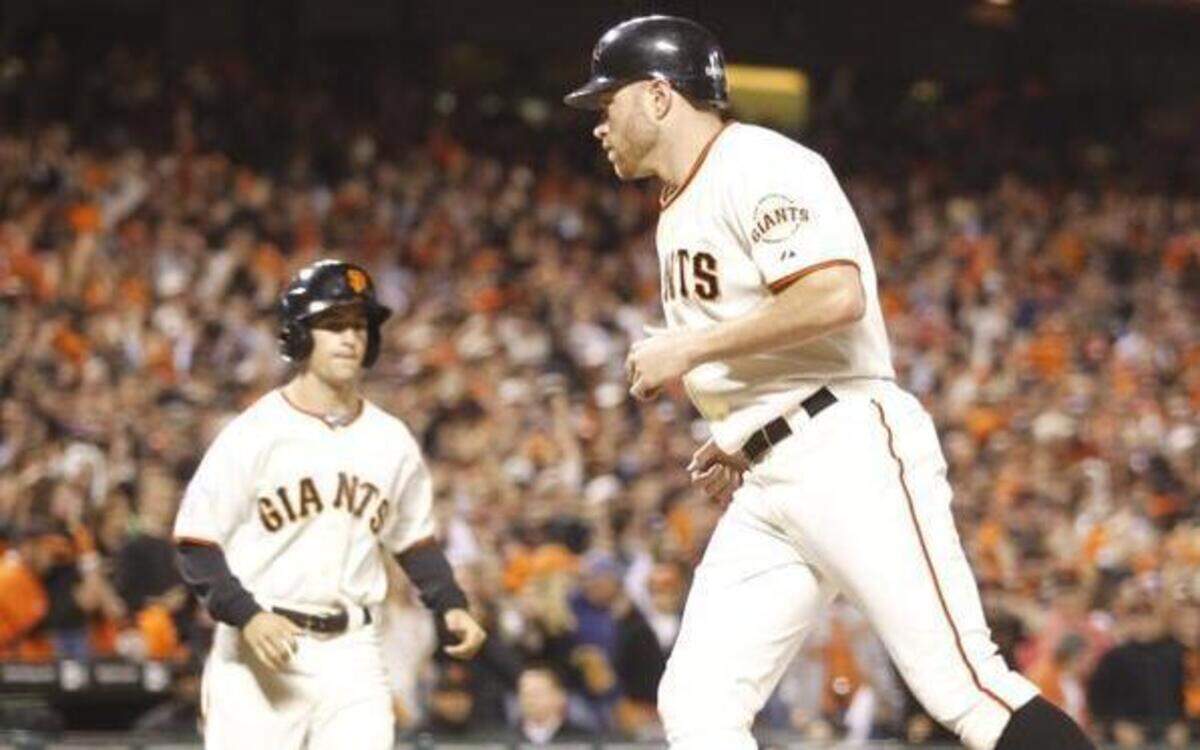 
Nate Schierholtz scores in the eighth inning for San Francisco against the Texas Rangers in Game 2 of the 2010 World Series. 
