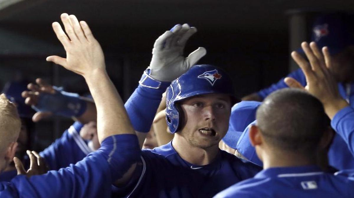 
High-fives all around for Justin Smoak, who has found himself playing for a World Series favorite.
