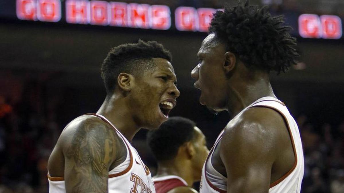 Texas guard Kerwin Roach, left, celebrates with Tevin Mack during Saturday’s 77-68 victory over Alabama in Austin. The Longhorns travel to face Michigan on Tuesday. The game will be televised at 8 p.m. on ESPN2.