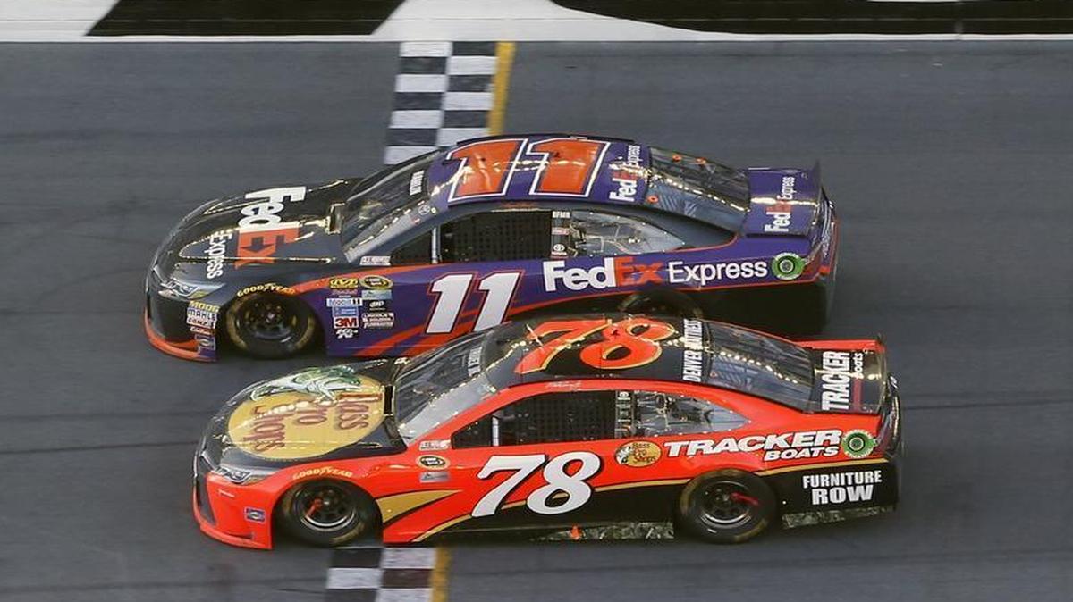 Denny Hamlin (11) beats Martin Truex Jr. (78) at the finish line to win the Daytona 500 on Sunday in Daytona Beach, Fla.