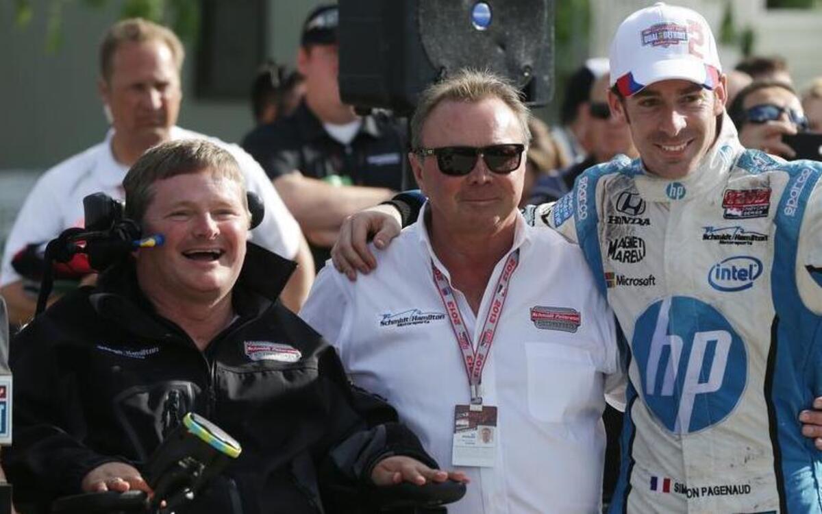 
Team owners Sam Schmidt, left, and Ric Peterson, center, stand with IndyCar Detroit Grand Prix auto race winner Simon Pagenaud, of France, on Belle Isle, Sunday, June 2, 2013, in Detroit. 
