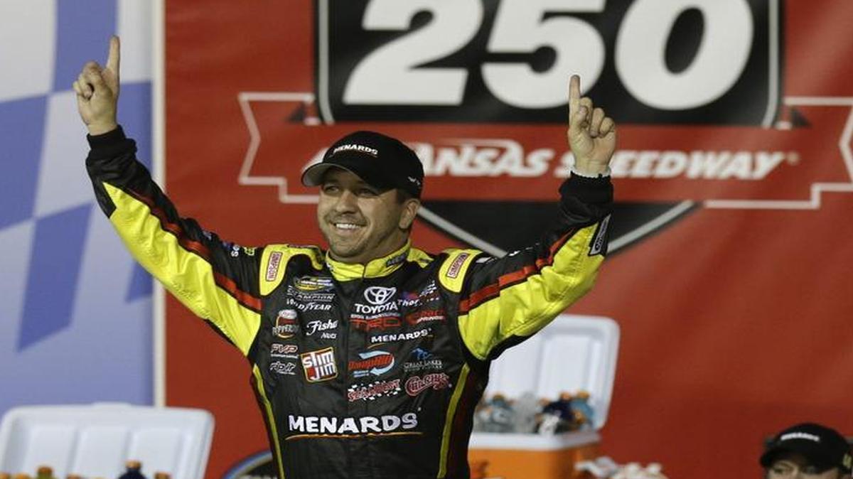
NASCAR driver Matt Crafton (88) celebrates in Victory Lane following a Truck Series race at Kansas Speedway in Kansas City, Kan. in May. 
