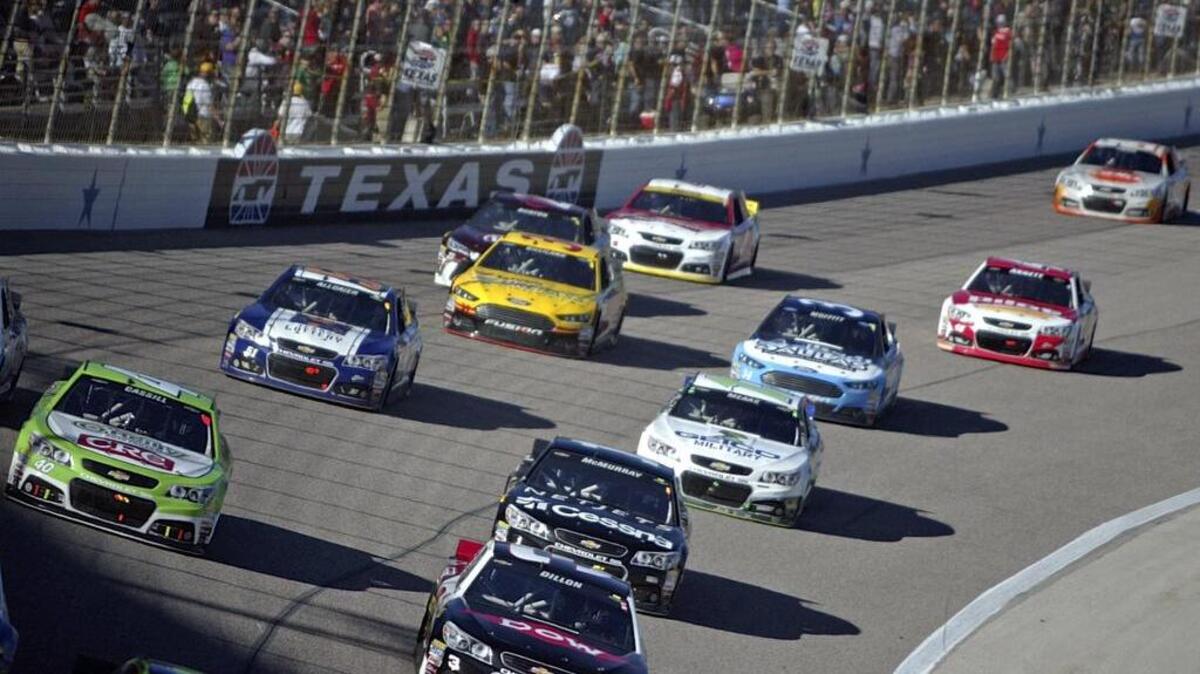Drivers head into turn one during the AAA Texas 500 at Texas Motor Speedway in November. KFWR/95.9 FM “The Ranch” will broadcast the races at the track under a three-year agreement.