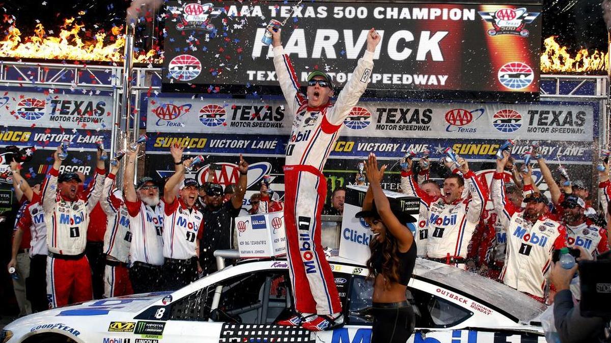 Kevin Harvick celebrates in Victory Lane after winning the Texas AAA 500 at Texas Motor Speedway.