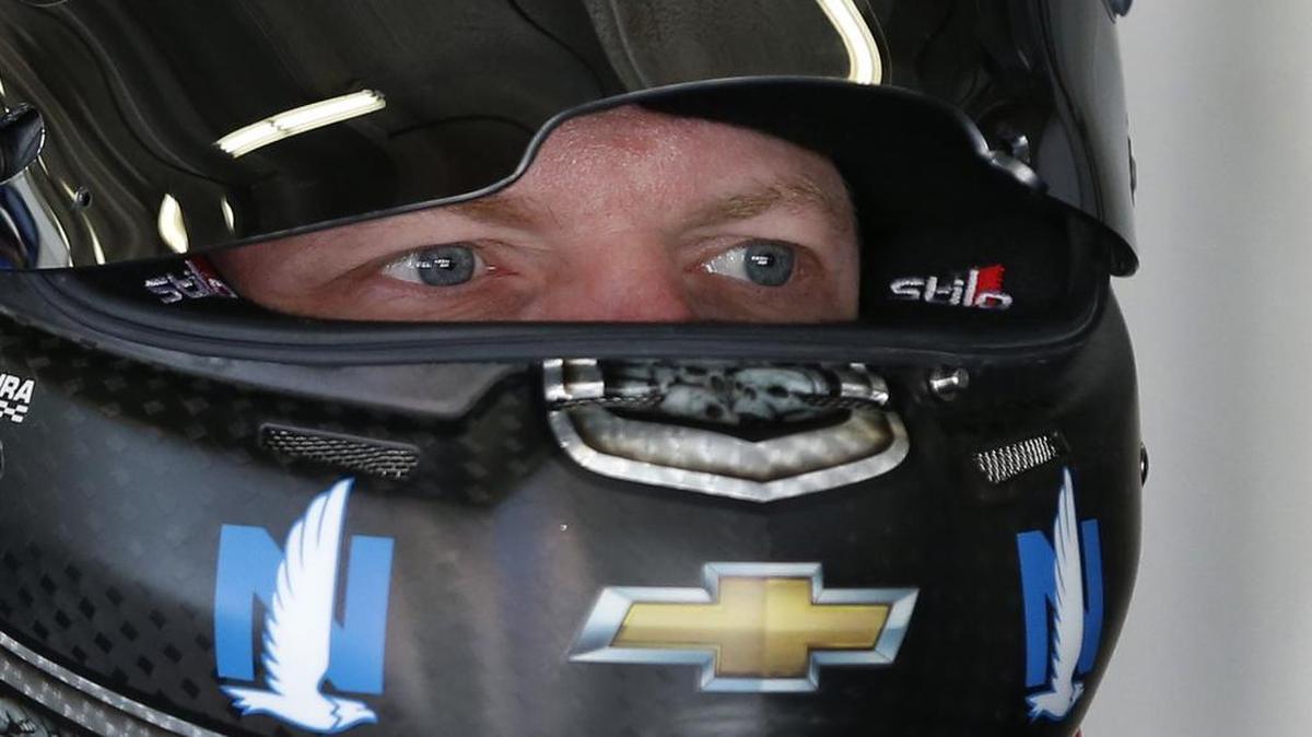 Dale Earnhardt Jr. prepares to climb into his car before practice for Sunday’s Daytona 500.