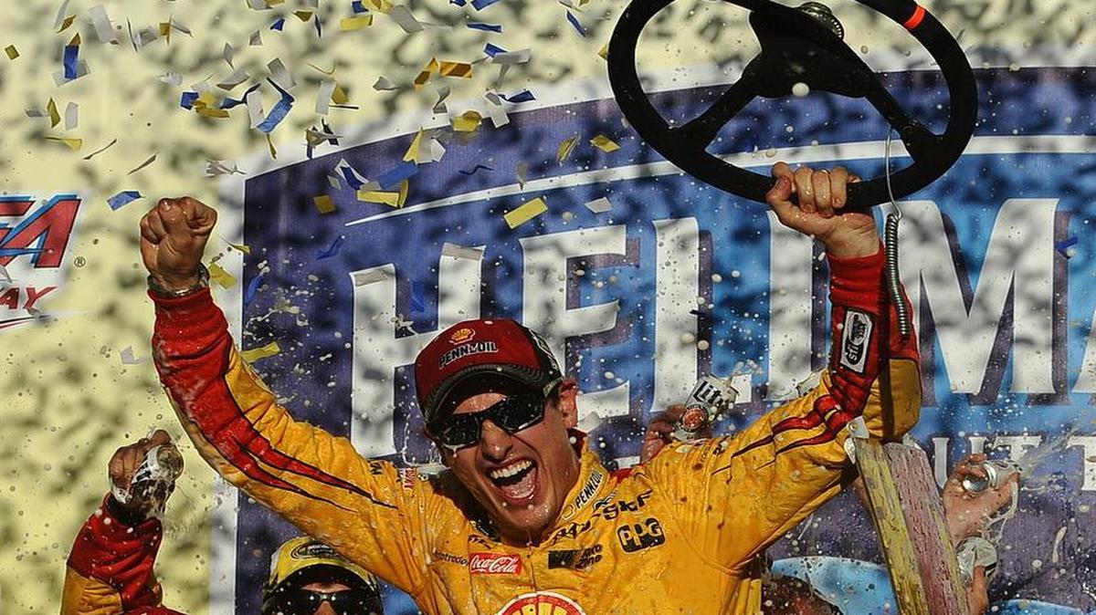 Joey Logano celebrates after winning the NASCAR Sprint Cup Series auto race auto race at Talladega Superspeedway, Sunday, Oct. 23, 2016, in Talladega, Ala.
