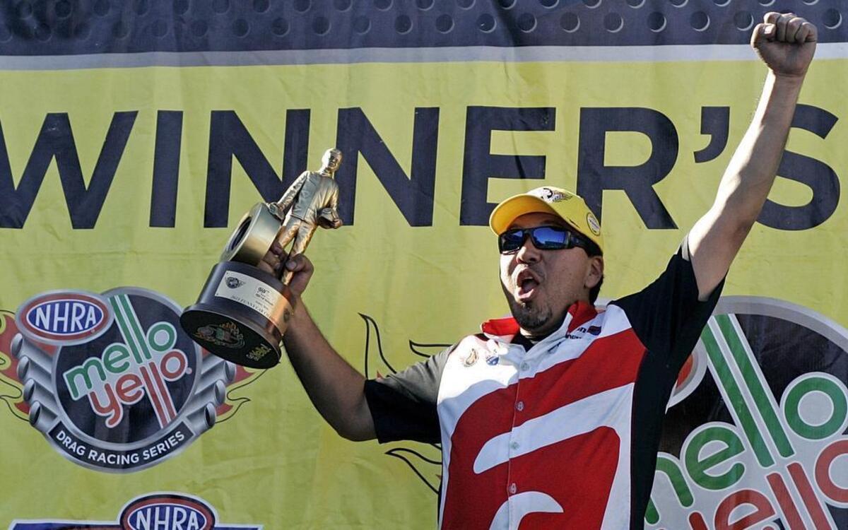 
Two-time Funny Car champion Cruz Pedregon celebrates his victory last year at the Texas FallNationals in Ennis.
