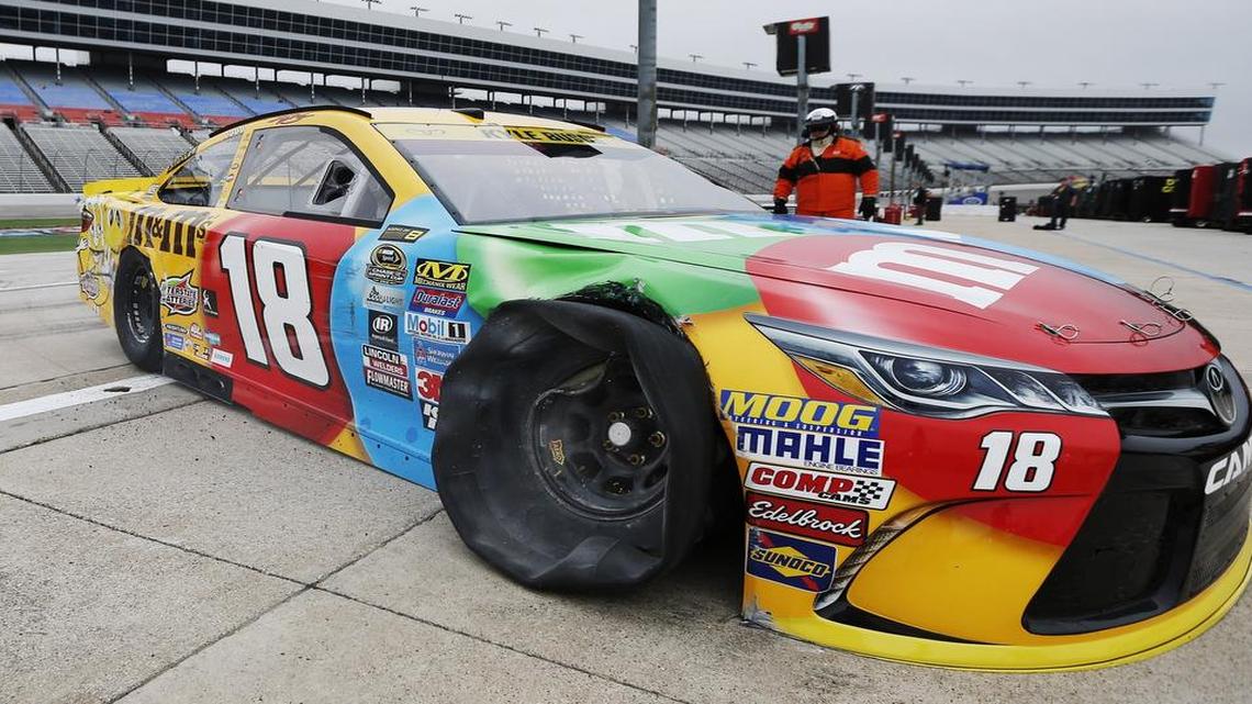 Sprint Cup driver Kyle Busch leaves the track after his right front tire blew, causing him to scrape the wall during Friday’s practice at Texas Motor Speedway.