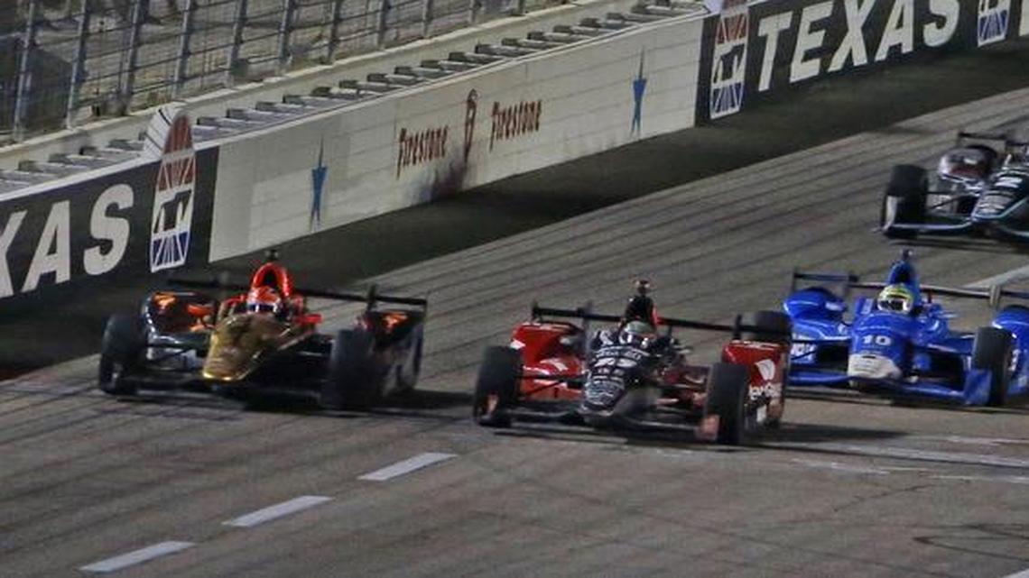 Race winner Graham Rahal, front right, edges James Hinchcliffe, left, cross the finish line in front of Tony Kanaan and Simon Pagenaud.
