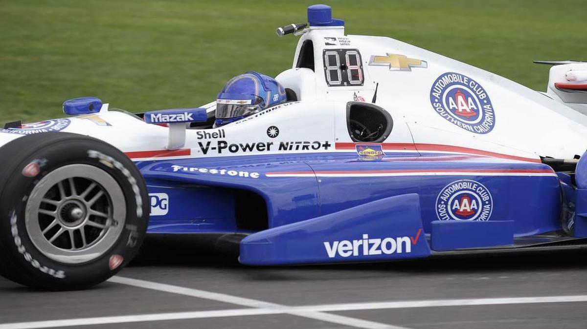 IndyCar racer Helio Castroneves compared the ease of driving on Texas Motor Speedway’s new racing surface to driving over a carpet.