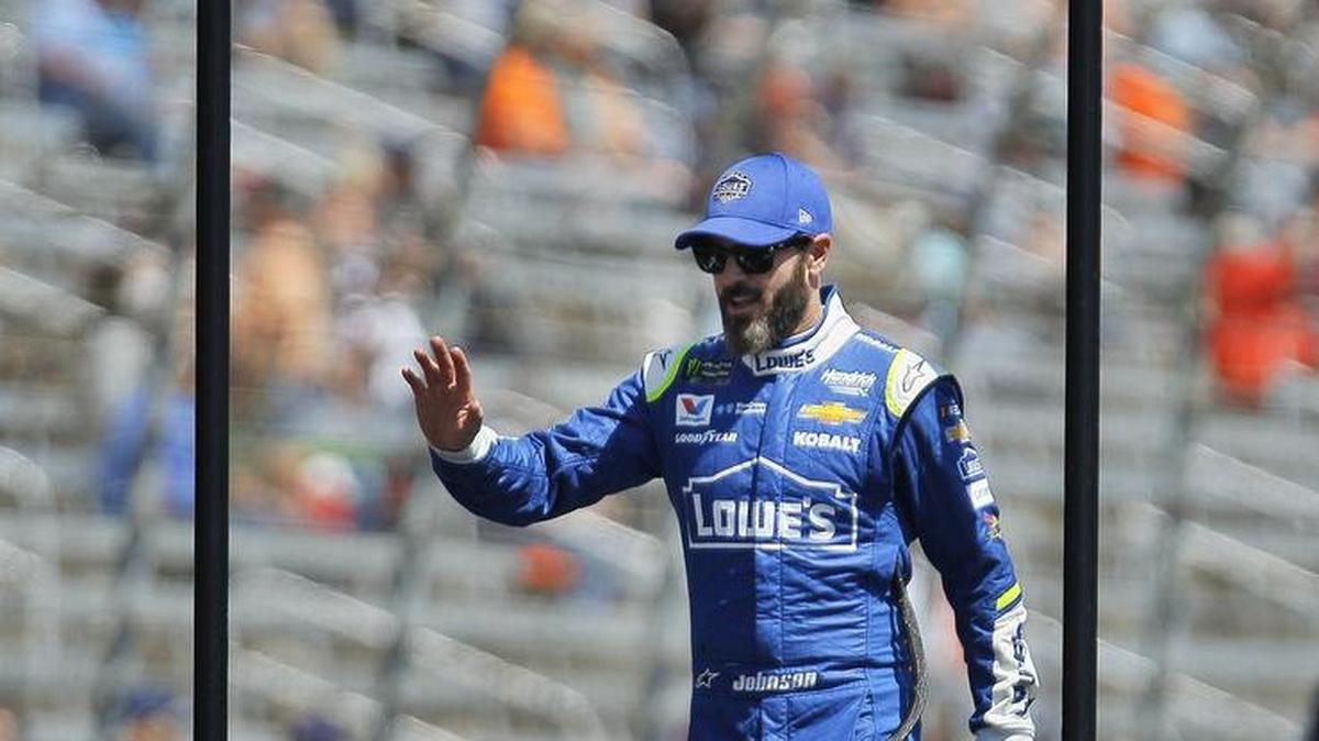 NASCAR driver Jimmie Johnson (48) waves to fans before the start of the O'Reilly Auto Parts 500 at Texas Motor Speedway in Fort Worth, Sunday, April 9, 2017.