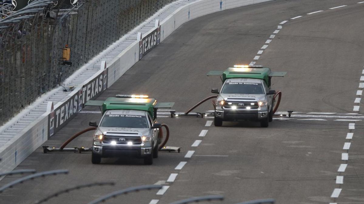 Crews worked to dry the track at Texas Motor Speedway after rain delayed April’s Duck Commander 500.