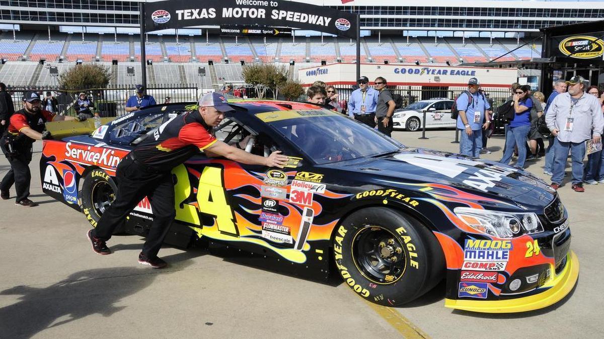 Jeff Gordon’s crew pushes his car in the garage area before NASCAR Sprint Cup practice at Texas Motor Speedway on Friday. Sunday will be Gordon’s last race at TMS before he retires at season’s end.