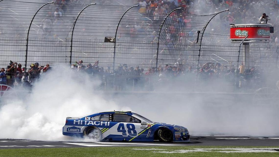 NASCAR driver Jimmie Johnson (48) celebrates winning the O’Reilly Auto Parts 500 with a burnout at Texas Motor Speedway in Fort Worth, Sunday, April 9, 2017.