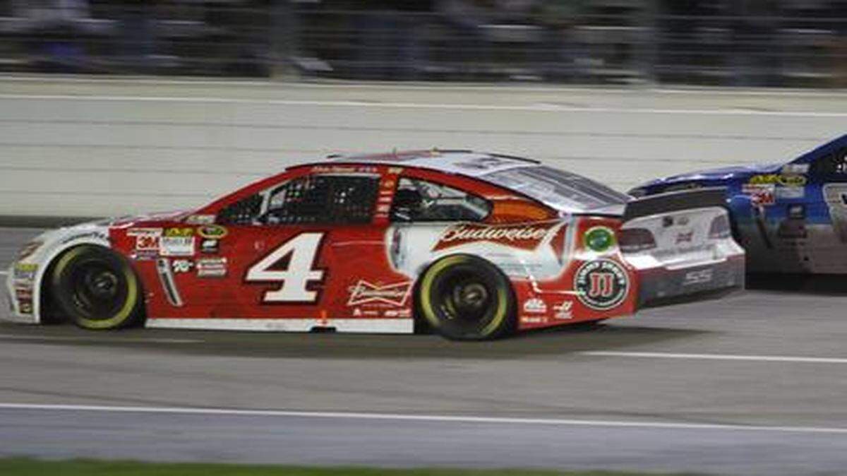 
Kevin Harvick squeezes past Dale Earnhardt Jr. on Saturday night to finish second in the Duck Commander 500 at Texas Motor Speedway.
