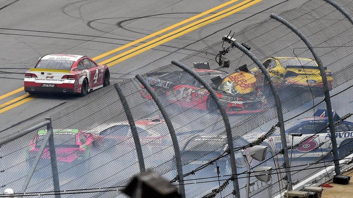 Sprint Cup Series driver Kevin Harvick (4) drives past a wreck at the end of Sunday’s Sprint Cup race at at Talladega.