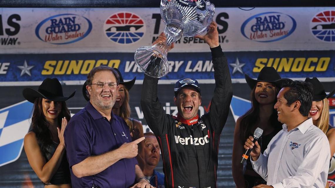 TMS president Eddie Gossage (l) with Will Power (12), the winner of the Verizon IndyCar Series Rainguard Water Sealers 600 on Saturday at Texas Motor Speedway.