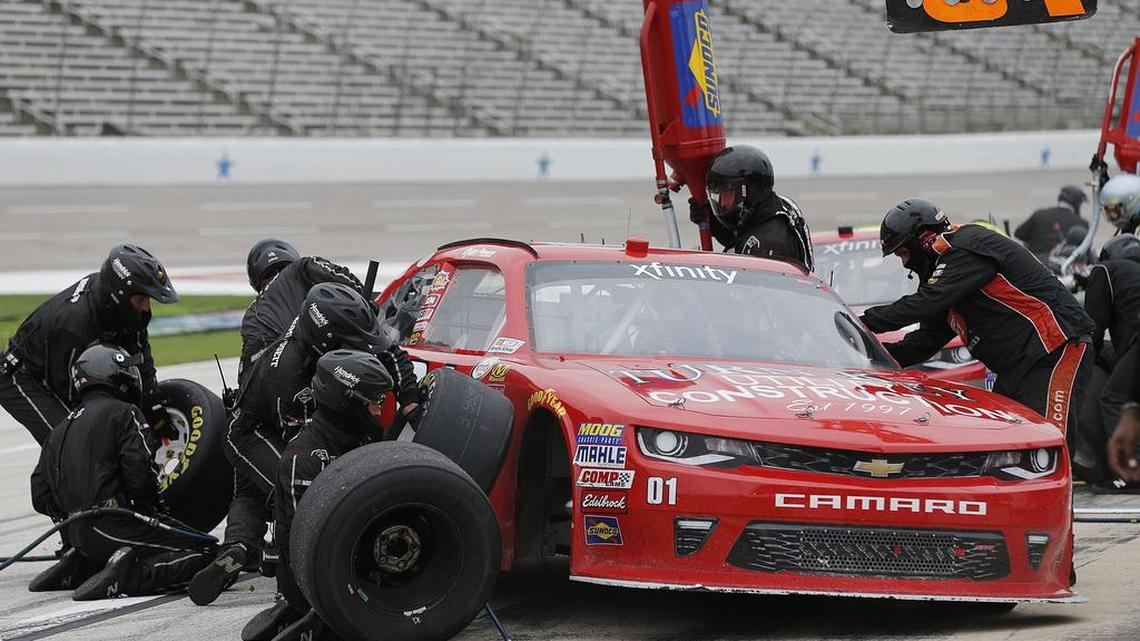 Ryan Preece’s pit crew services his car during the O’Reilly Auto Parts Challenge at Texas Motor Speedway.