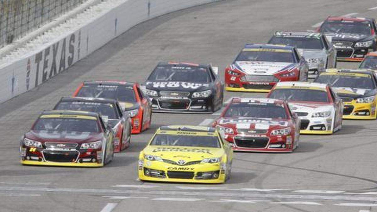 
Matt Kenseth in 20, the Dollar General Toyota, leads the field across the start finish line to start the NASCAR Sprint Cup Series AAA Texas 500 in November. The Duck Commander 500 is Saturday at TMS.
