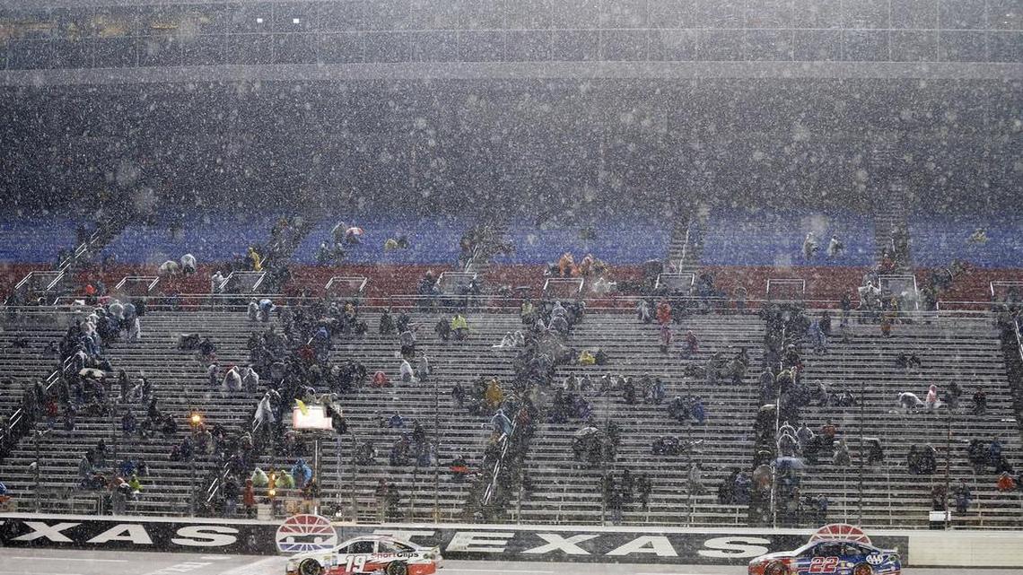A few fans stuck around until the end of the rain-delayed and rain-shortened AAA Texas 500 on Sunday.