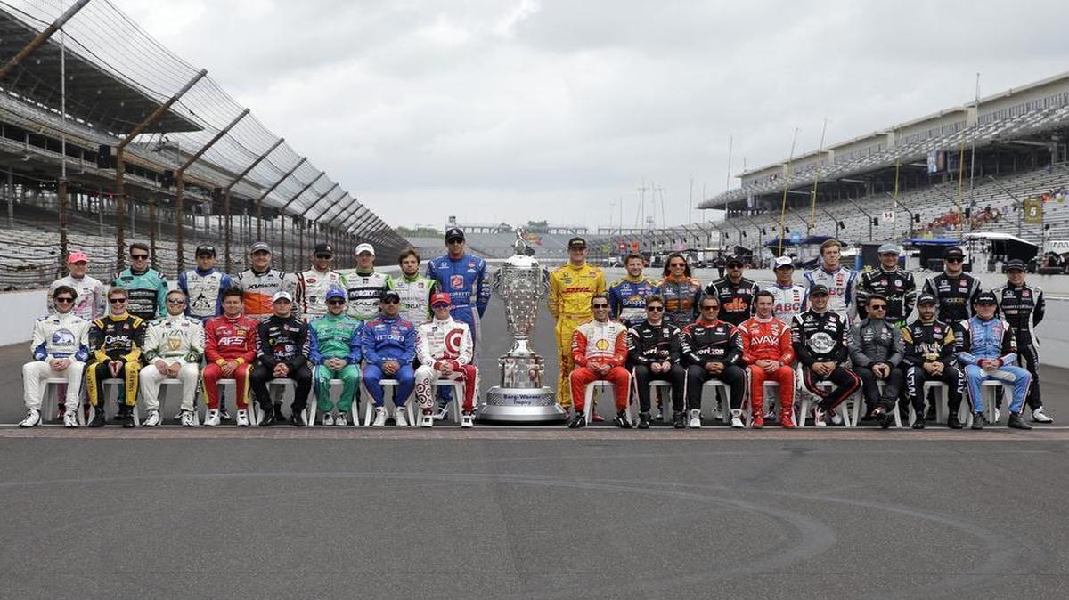 
The starting line up for the Indianapolis 500 pose on the start/finish line before the start of practice for the Indianapolis 500 auto race at Indianapolis Motor Speedway in Indianapolis.
