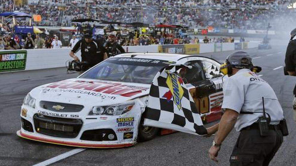
Dale Earnhardt Jr. heads to Victory Lane as he celebrates after winning the NASCAR Sprint Cup Series auto race at Martinsville Speedway in October.
