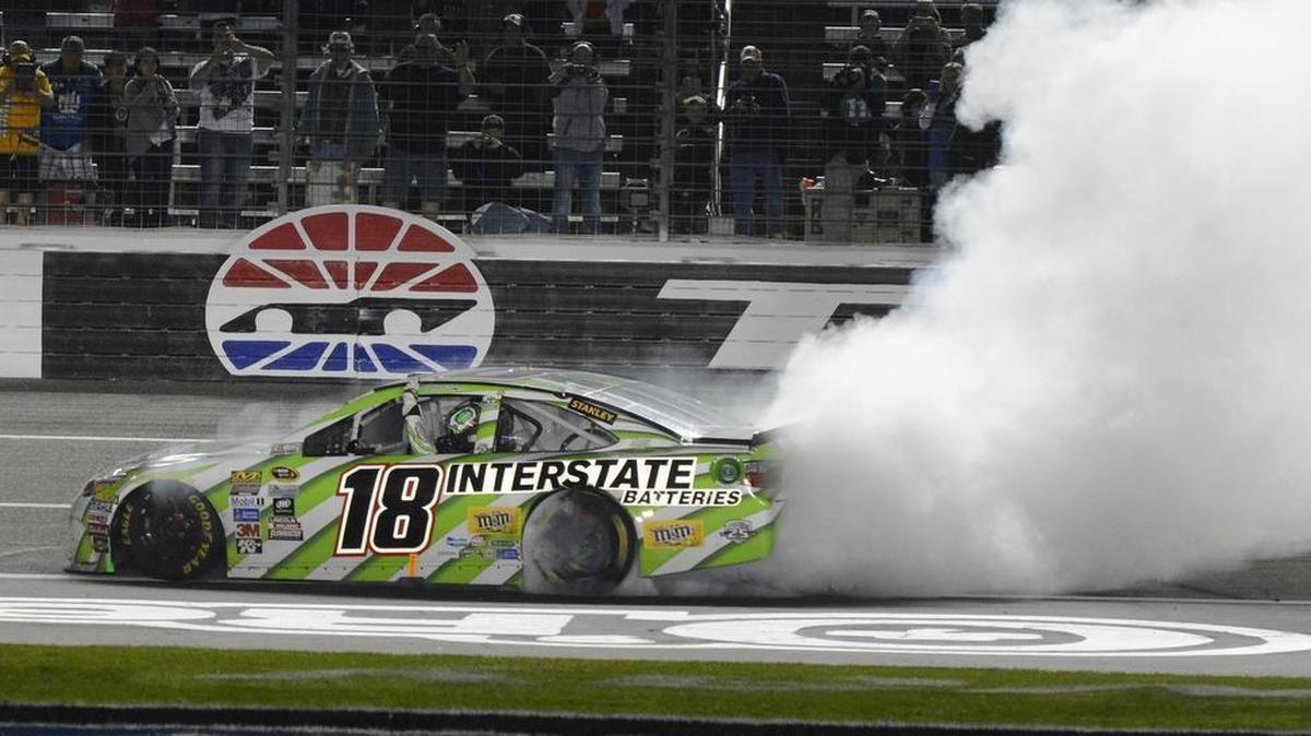 Kyle Busch does a burnout after winning the Duck Commander.