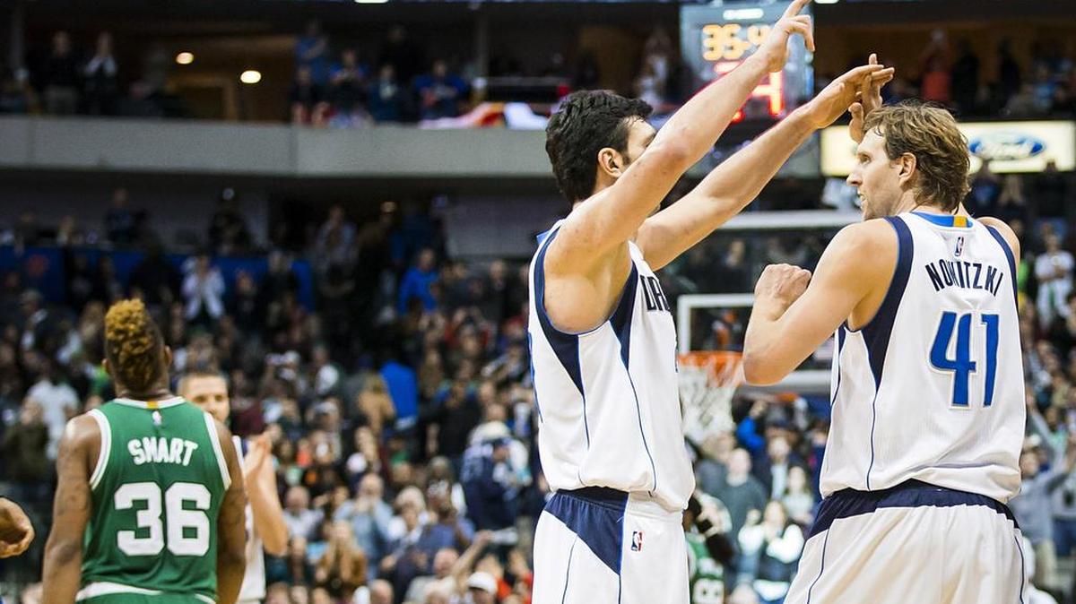 Dirk Nowitzki, right, celebrating with teammate Zaza Pachulia, might have injured his right knee in Monday’s overtime victory over the Celtics when he hit the floor a couple times.