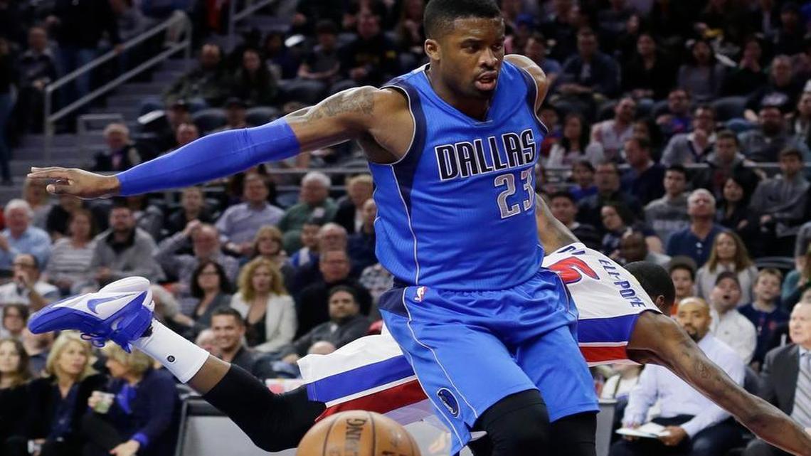 Dallas Mavericks guard Wesley Matthews (23) knocks Detroit Pistons guard Kentavious Caldwell-Pope out of bounds during the first half .