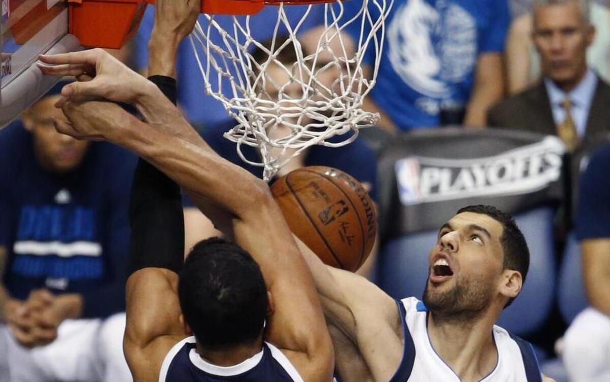 Dallas Mavericks center Salah Mejri (50) fouls Oklahoma City Thunder guard Andre Roberson (21) in the third period