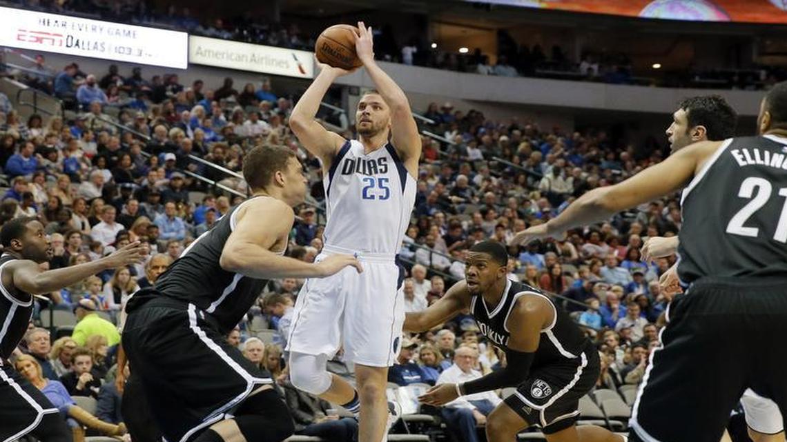 Mavericks forward Chandler Parsons, shooting, had 19 points and a season-high 10 rebounds for his first double-double of the season Friday against the Nets.