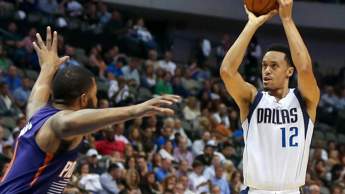 Mavericks guard John Jenkins, right, in an Oct. 21 preseason game against the Suns, is averaging 3.1 points and 9.1 minutes while playing in only 20 games this season.