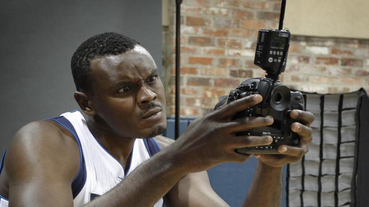 
Mavericks center Samuel Dalembert poses for a selfie at media day.

