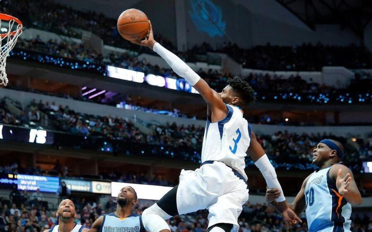 Dallas Mavericks forward Nerlens Noel (3) palms the ball as takes two long strides Memphis Grizzlies forward Zach Randolph (50) for a layup and the foul during the first half at the American Airlines Center on Friday, March 3, 2017 in Dallas, TX.