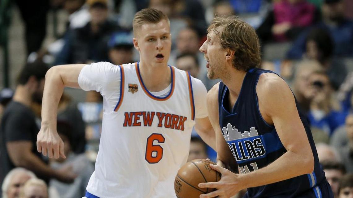 New York Knicks forward Kristaps Porzingis keeps an eye on Mavericks veteran Dirk Nowitzki during first-half action of their NBA game on Wednesday.