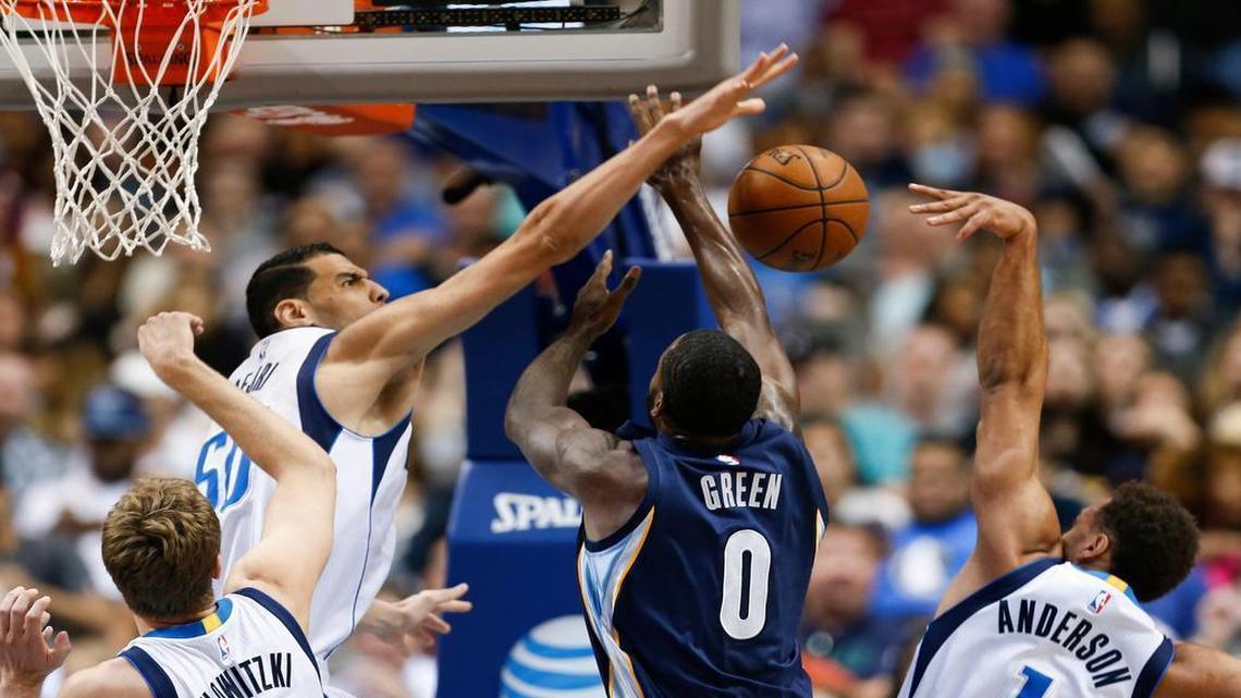 JaMychal Green, foreground, and the Grizzlies played a physical game, but Salah Mejri and the Mavs overcame it.