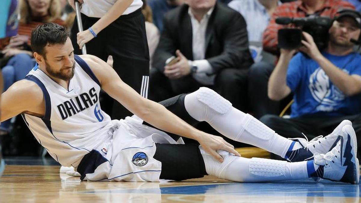 Dallas Mavericks center Andrew Bogut will miss at least 10 days after suffering a bone bruise in his right knee Monday against Charlotte. Bogut leads the Mavs in rebounding.